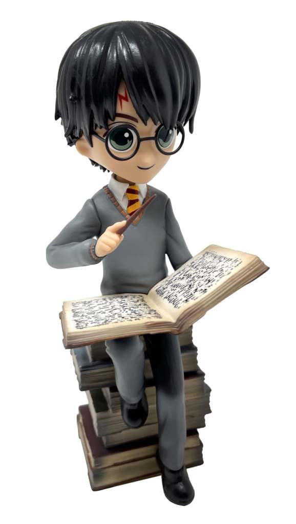 89677-HP HARRY ON PILE OF SPELL BOOKS FIGURE